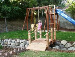 This 6 ft double rail child friendly bridge  adds nicely to this play area. 